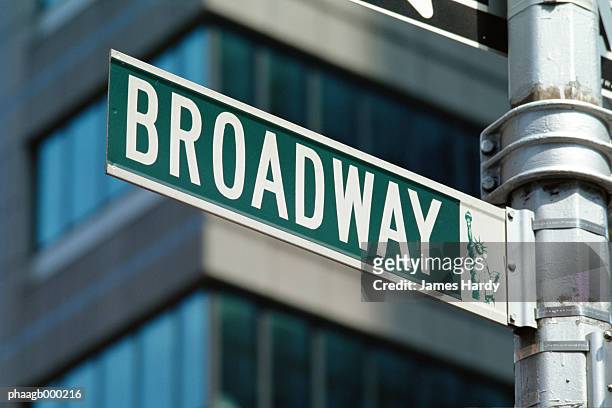 new york, manhattan, broadway street sign, close-up - broadway street stock pictures, royalty-free photos & images