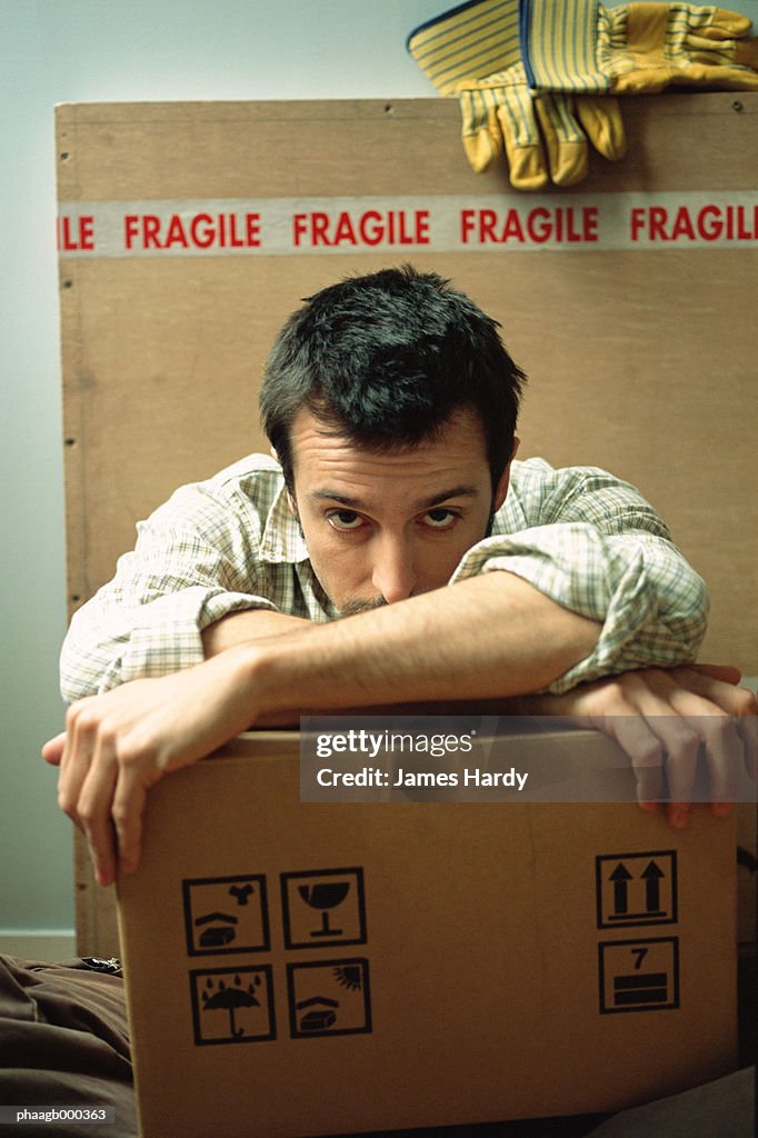 Man with cardboard boxes