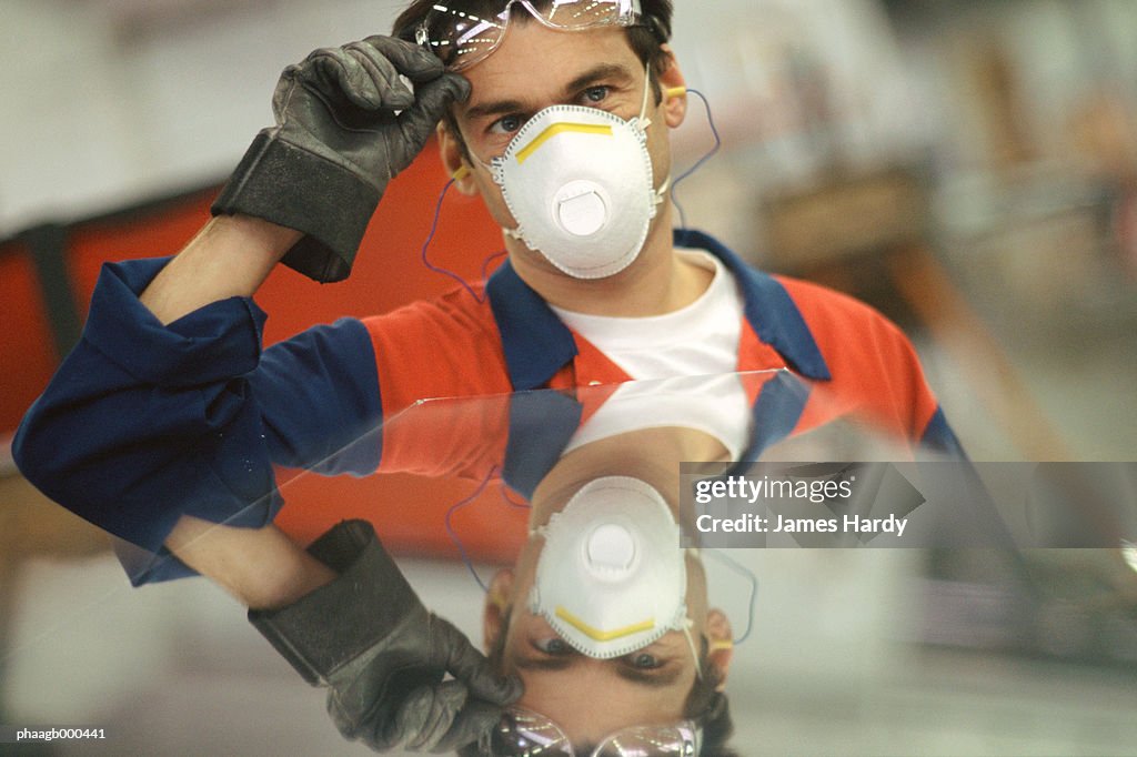Manual worker wearing protective gear
