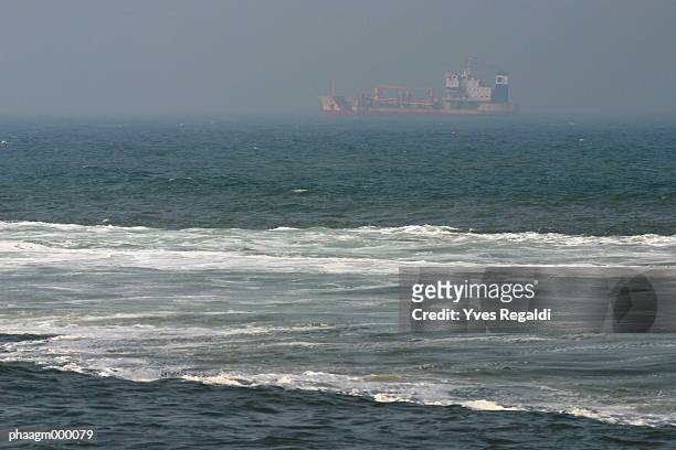 france, calais, cargo boat at sea - yves stock pictures, royalty-free photos & images