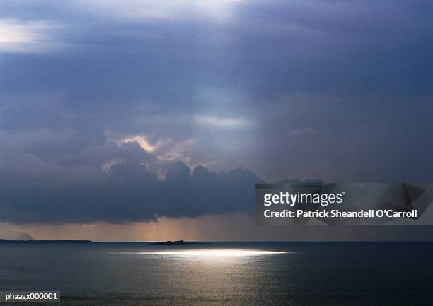 sunbeam shining on sea - carroll stock pictures, royalty-free photos & images