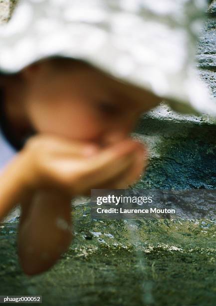 girl drinking water from cupped hands - mouton stock pictures, royalty-free photos & images