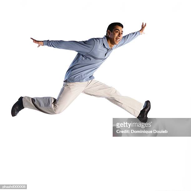 man jumping - running midair stock pictures, royalty-free photos & images