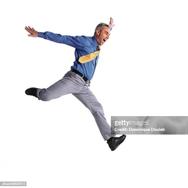 man jumping - human limb stock pictures, royalty-free photos & images