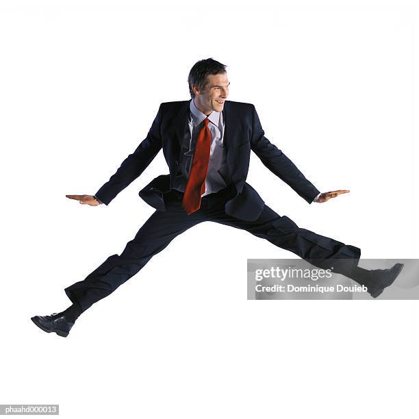 man jumping - breitbeinig stock-fotos und bilder
