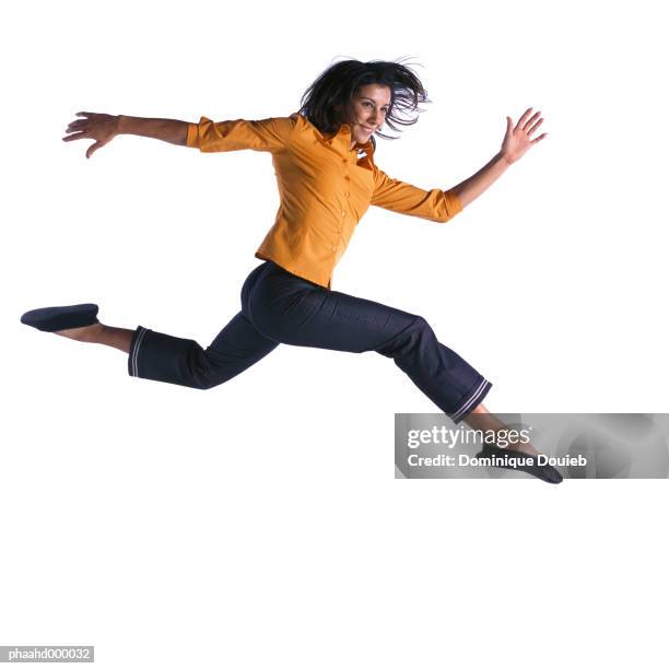 woman jumping - gambe divaricate foto e immagini stock