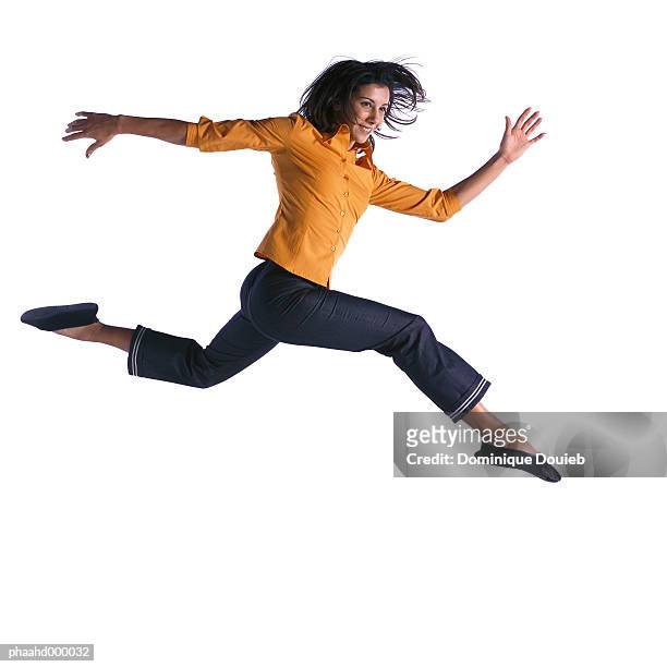 woman jumping - legs spread woman stock pictures, royalty-free photos & images