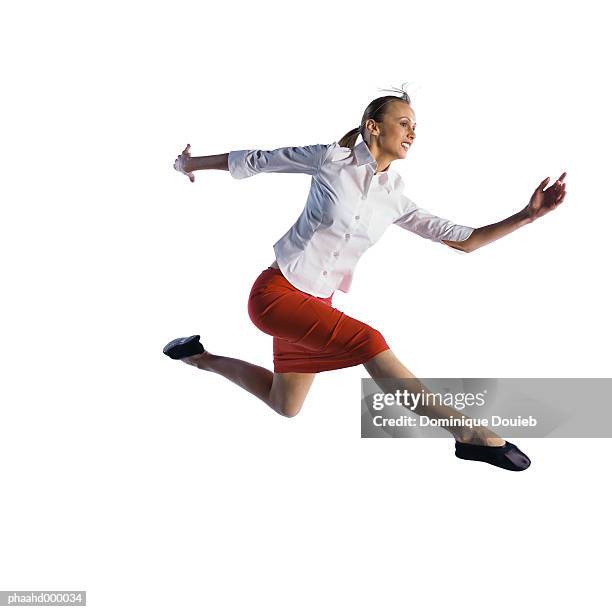 woman jumping - running midair stock pictures, royalty-free photos & images