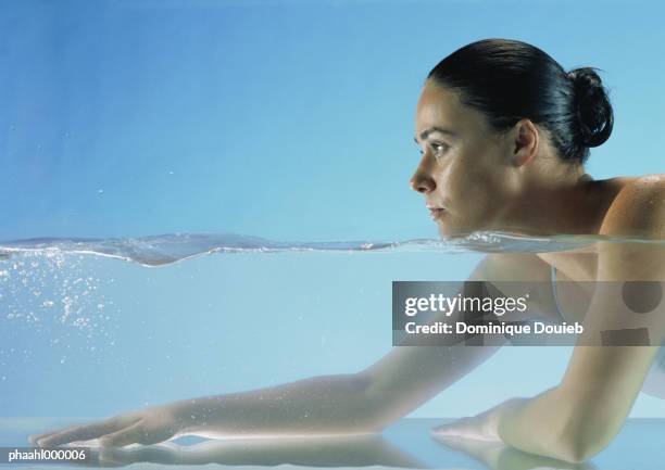 woman in water, side view - balneotherapy stock pictures, royalty-free photos & images