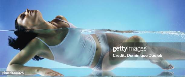 woman wearing underclothes in water, head back - balneotherapy stock pictures, royalty-free photos & images