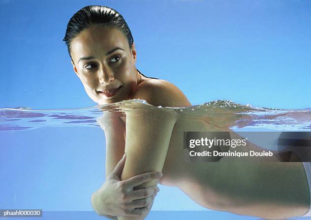 semi-nude woman in water, smiling - balneotherapy stock pictures, royalty-free photos & images