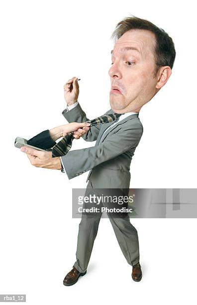 conceptual caricature of a caucasian man in a suit as he gets attacked by an arm coming out of his palm pilot - people coming of age purify with icy water in tokyo stockfoto's en -beelden
