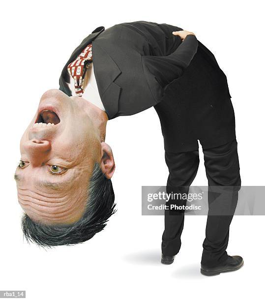 conceptual caricature of a caucasian man in a suit as he literally bends over backwards - bending over backwards stock pictures, royalty-free photos & images