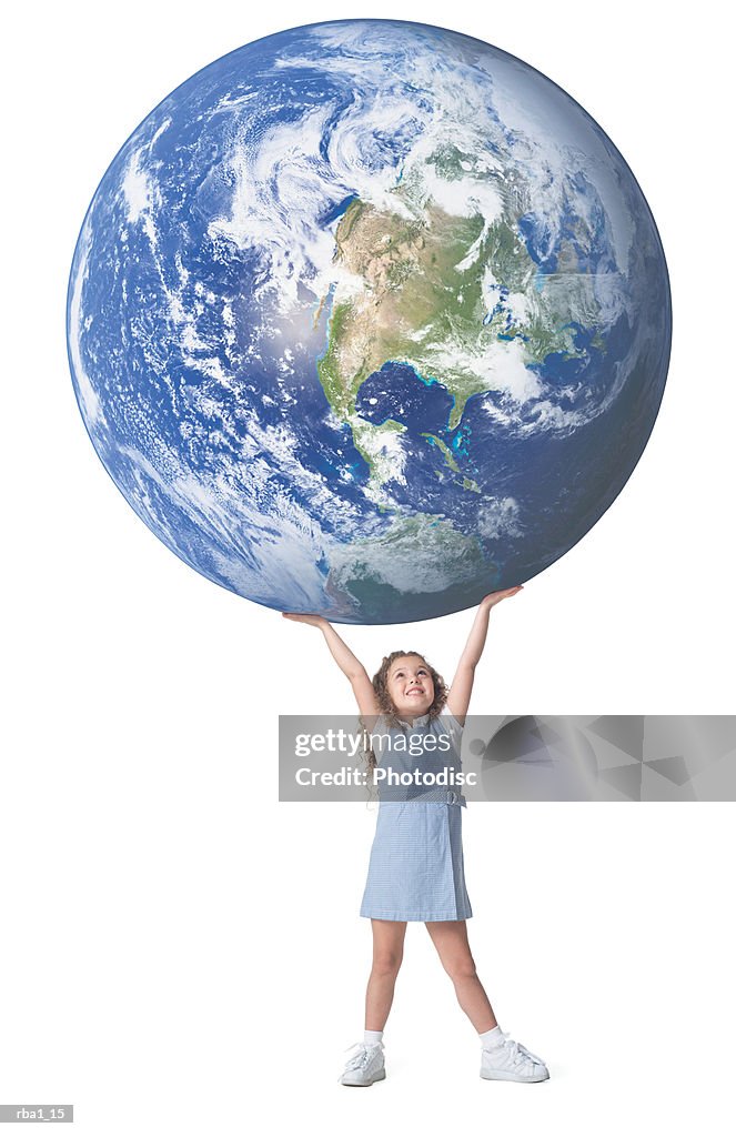 Conceptual photo of a little caucasian girl as she holds a giant earth above her head