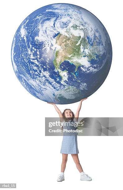 Conceptual Photo Of A Little Caucasian Girl As She Holds A Giant Earth Above Her Head, Foto de stock