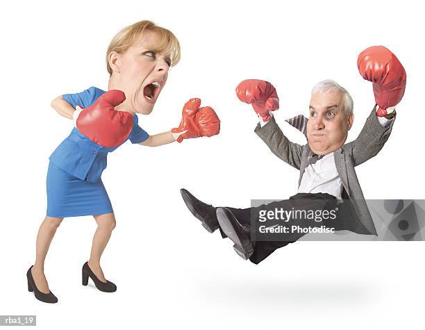 conceptual caricature of caucasian businessman in suit he boxes gets punched out by a businesswoman - funny boxing bildbanksfoton och bilder