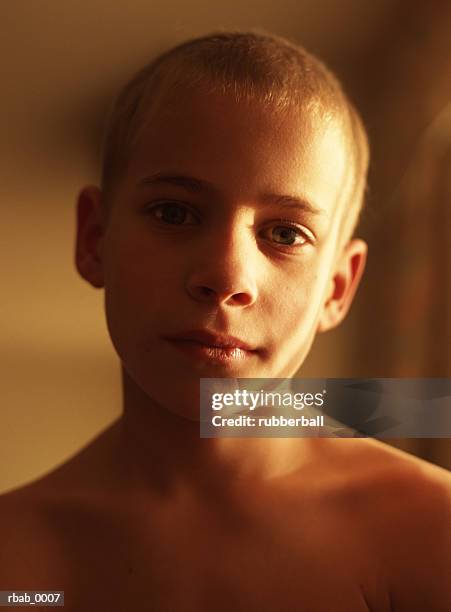 a young man is looking into the camera with a sad or serious look on his face - or stock pictures, royalty-free photos & images