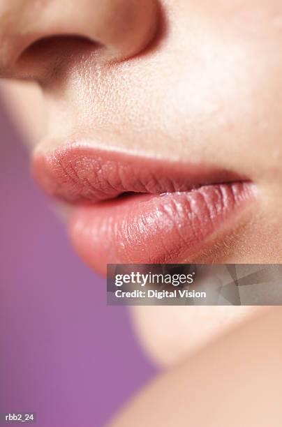a close up shot of the full lips of a young caucasian girl - lippen stock-fotos und bilder