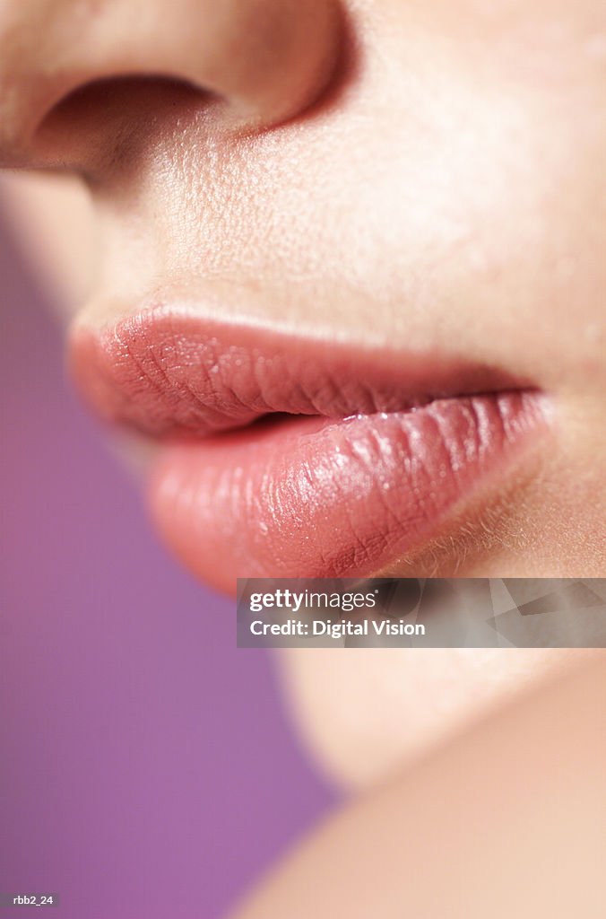 A close up shot of the full lips of a young caucasian girl