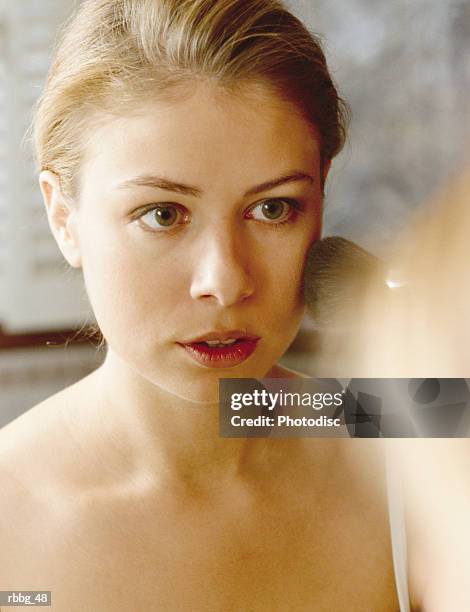 beautiful blonde staring at her reflection - reflection foto e immagini stock