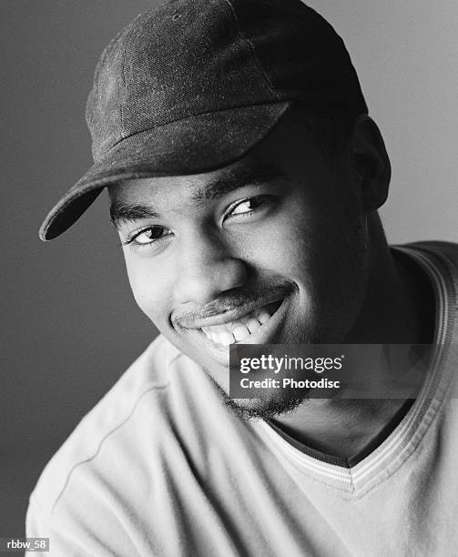 an athletic african american man gives a big friendly smile - big smile stockfoto's en -beelden