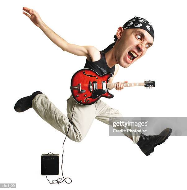 caricature young caucasian male wears black tank top bandana jumps into air rocking out with guitar - modern rock stock pictures, royalty-free photos & images