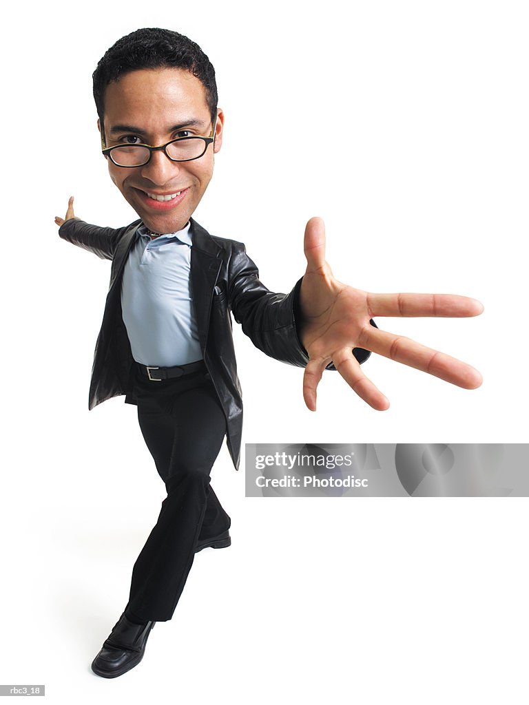 An ethnic man in glasses a blue shirt black slacks and a leather jacket takes a step forward and extends his arms and hands out