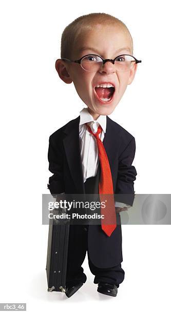 a little caucasian boy dressed up in his fathers business attire as he opens his mouth and screams crazily - nachahmung erwachsener stock-fotos und bilder