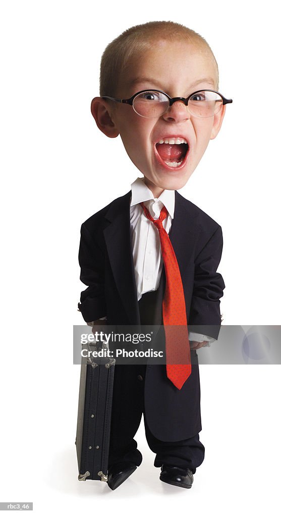 A little caucasian boy dressed up in his fathers business attire as he opens his mouth and screams crazily