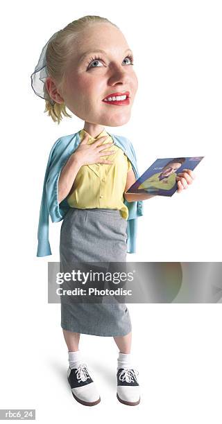 photo caricature of a caucasian female teenager in 50s retro clothing as she holds an album and dreams of her teen idol - suporte de armazenamento de áudio analógico imagens e fotografias de stock