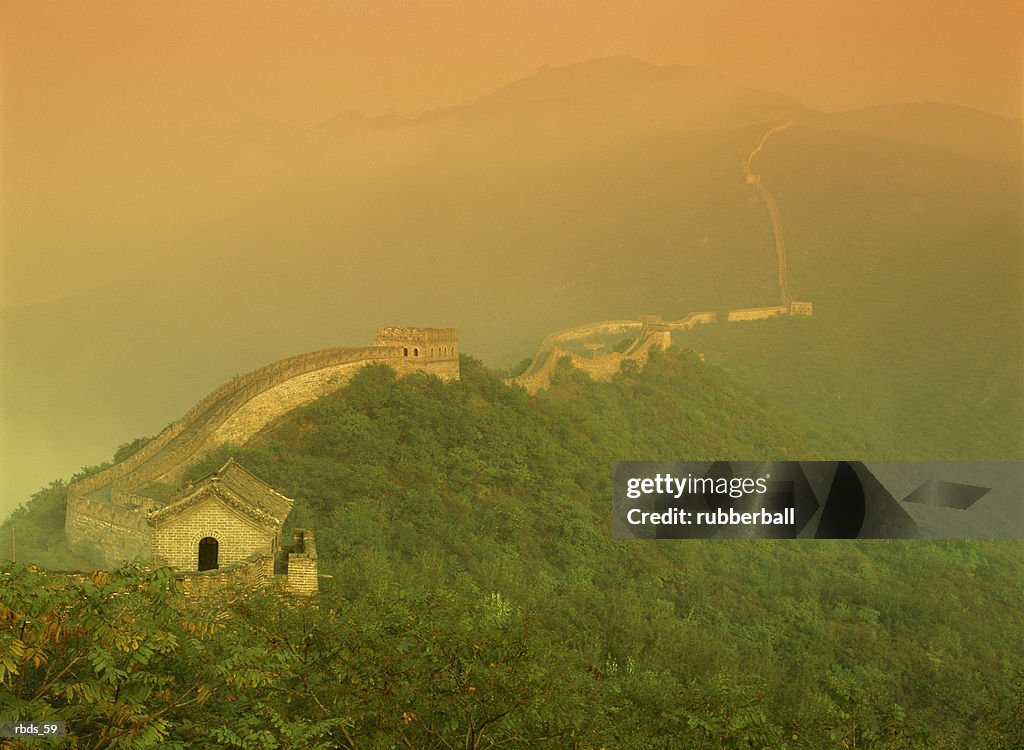 The great wall of china with a warm yellow sky