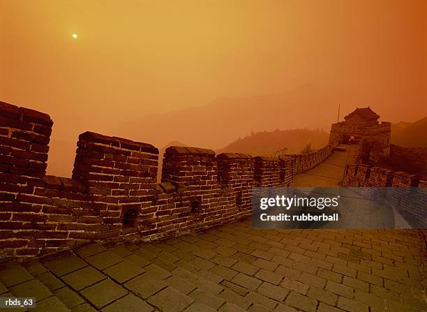 inside the great wall of china with an orange and yellow sky - northern china stock pictures, royalty-free photos & images