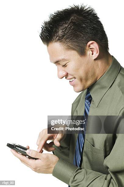 medium shot of a young adult business man as he uses his electronic planner - uses stock pictures, royalty-free photos & images