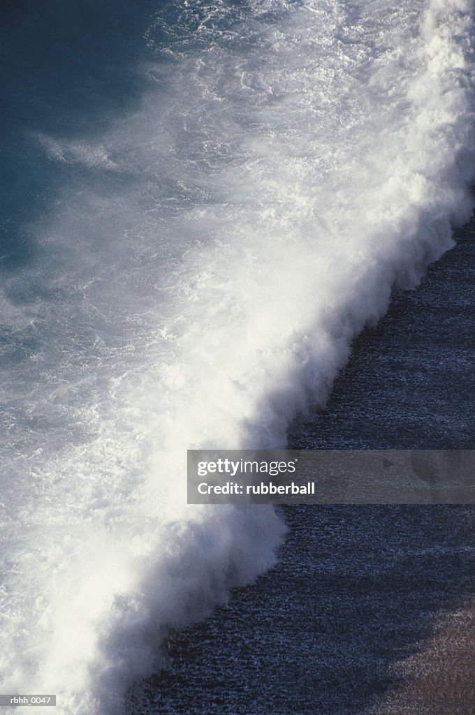 Abstract photograph of a waves crashing over a beach