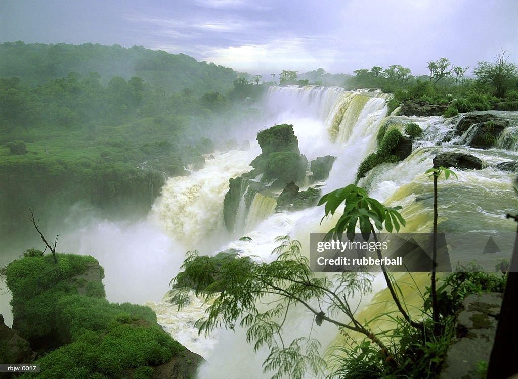 A horizontal of a lush jungle waterfall in south america or africa