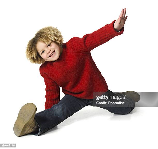 full body shot of a curly haired female child as she does the splits and smiles - curly stock pictures, royalty-free photos & images