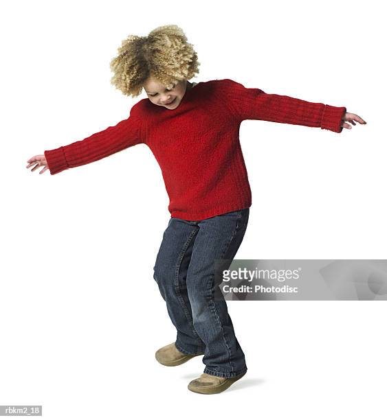 full body shot of a curly haired female child as she spins around and dances - curly stock pictures, royalty-free photos & images