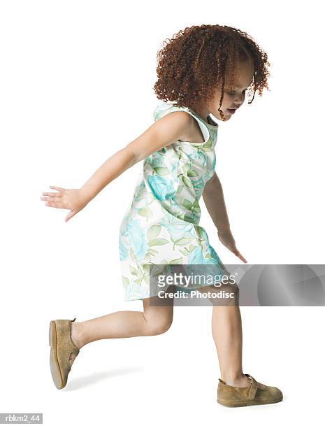 full body shot of a female child as she runs forward playfully - full body isolated bildbanksfoton och bilder