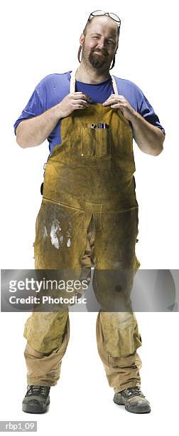 full length shot of an adult male in work overalls as he confidently smiles at the camera - full body isolated bildbanksfoton och bilder