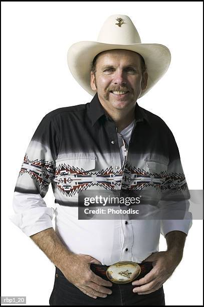 waist up shot of an adult male in a cowboy hat and shirt as he smiles at the camera - handlebar moustache stock pictures, royalty-free photos & images