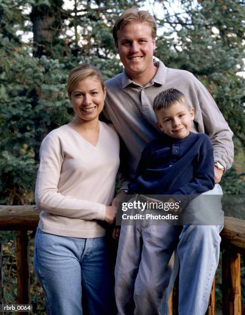 an outdoor portrait of a small caucasian family - pinaceae imagens e fotografias de stock