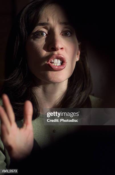 an angry caucasian woman yells at another person - aother stock pictures, royalty-free photos & images
