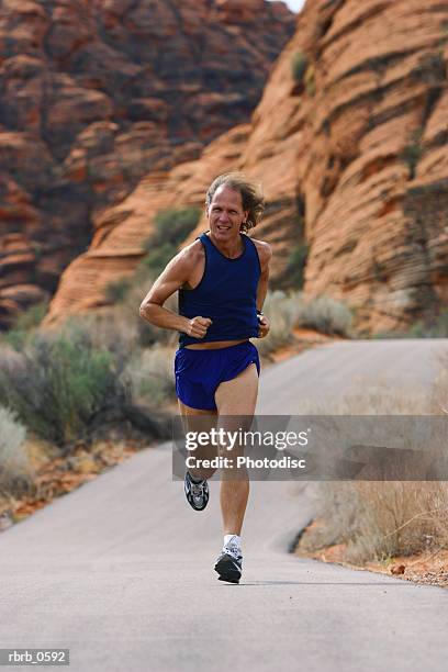 Guy Running Down Red Rocks Backwards 362 Desert Road Motion Stock Photos, High-Res Pictures, and Images ...