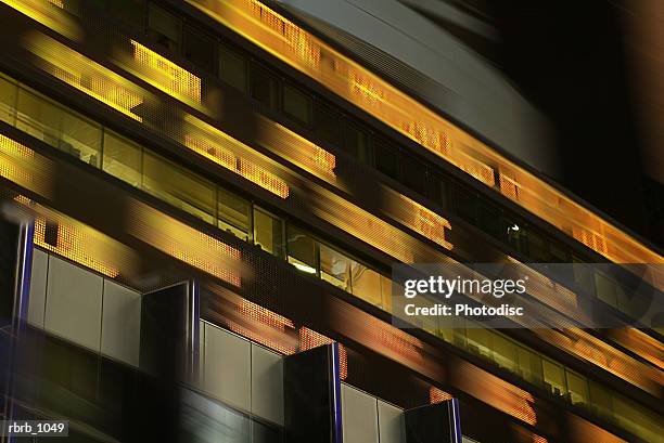 photograph of a wall street display showing current stock and investment prices - share prices of consumer companies pushes dow jones industrials average sharply higher stockfoto's en -beelden