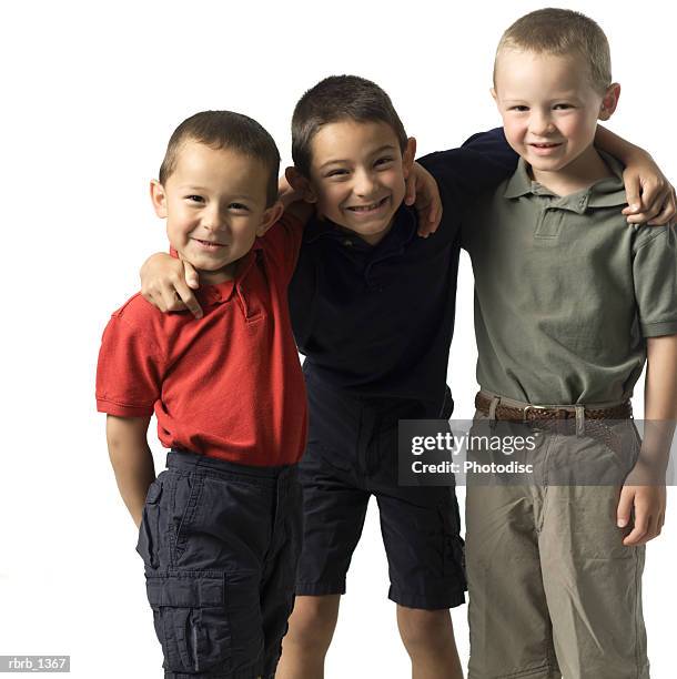 three caucasian child brothers put their arms around each other as they all smile - put together stock pictures, royalty-free photos & images