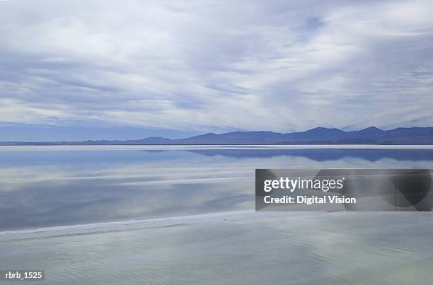 landscape photogrpah of a blue sky and lake at the utah salt flats - bonneville salt flats stock pictures, royalty-free photos & images