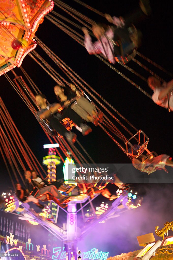 Simple Inverting Fair Rides Photograph Of People Spinning And Riding A Swing Ride At A Fair High ...