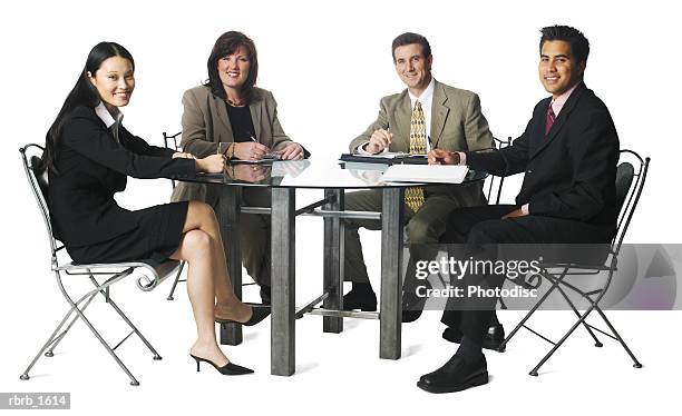 a group of four business people sit around a table and smile - smile bildbanksfoton och bilder