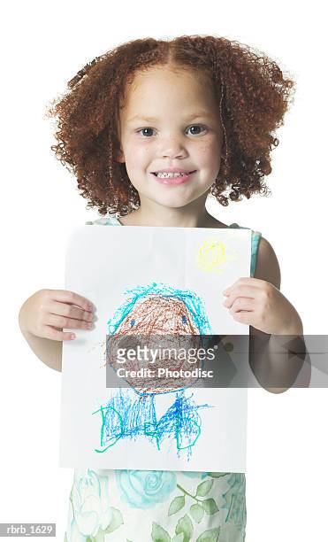 an african american female child with curly hair shows off a drawing she did with crayons - curly stock pictures, royalty-free photos & images