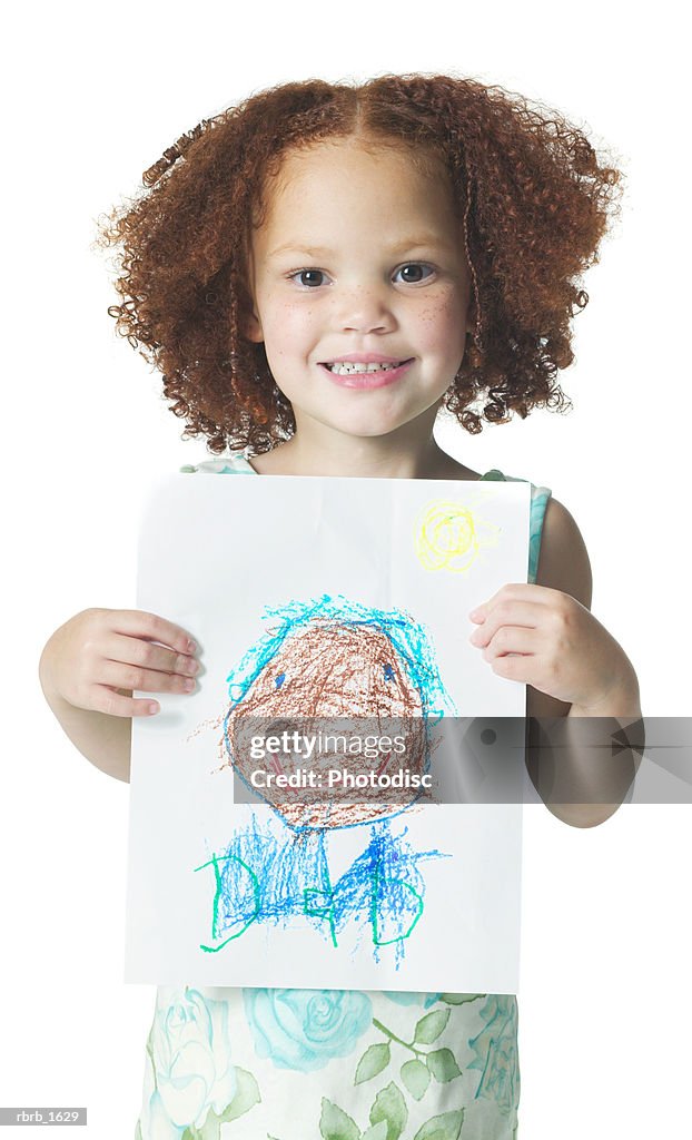 An african american female child with curly hair shows off a drawing she did with crayons